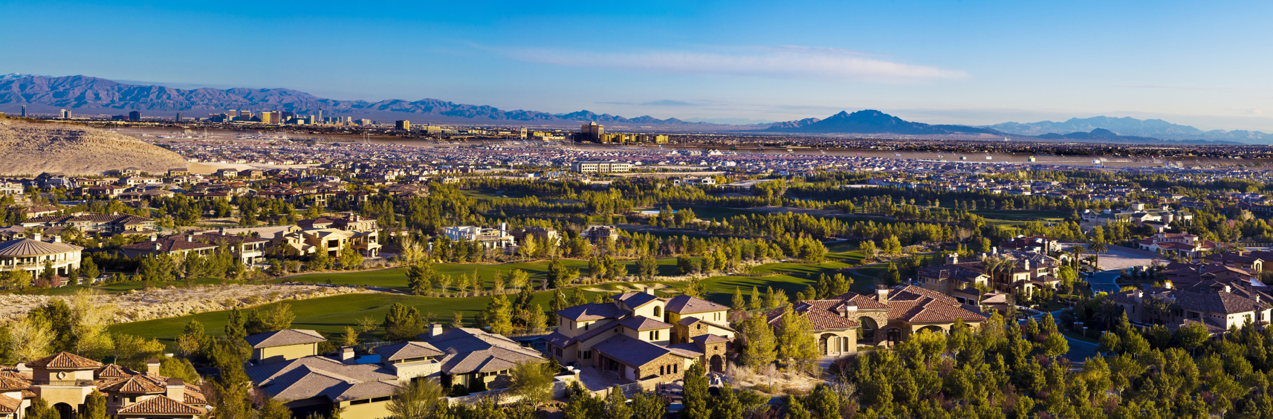 Beautiful aerial view of residential community in Las Vegas with mountains in the background.